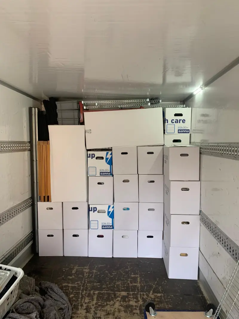Moving boxes and furniture parts in the truck.
